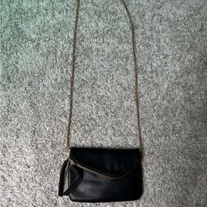 Anthropologie black purse with gold chain